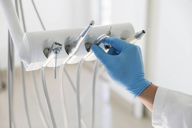 Professional Tooth Extraction technician working in Midland County County, MI